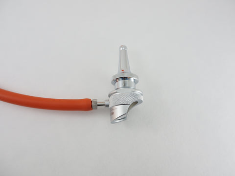 Close up of the Bruenings half lens diagnostic head with a tubing connector and a Bruenings Ear Specula.