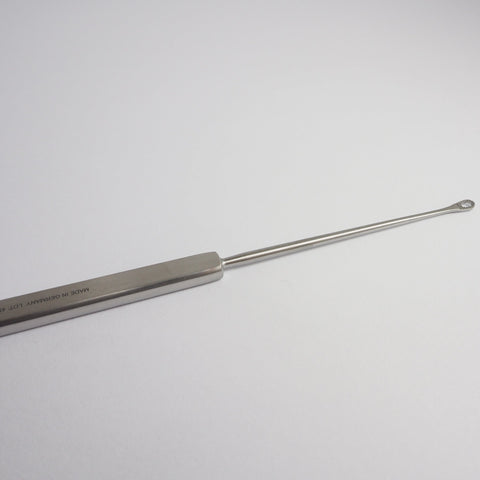 Shapleigh Ear Curette with a flat handle and serrated small tip